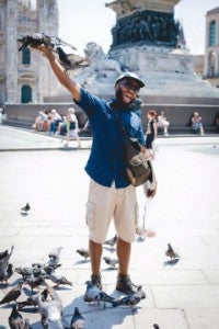 Michael Reed feeds the birds in Italy in this photo taken by Danielle Marroquin.