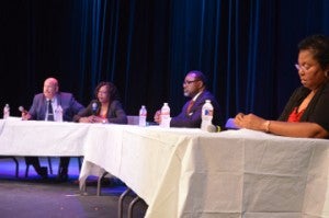 Port Arthur Independent School District trustee candidates Robert Reid, left, Lloyd Marie Johnson, the Rev. Donald Frank Sr. and Dianne Brown field questions during a political forum hosted by the Port Arthur Alumnae Chapter of Delta Sigma Theta Sorority at Lamar State College Port Arthur’s Performing Arts Center on Tuesday. One candidate, Michelle Lockwood-Snodgrass, was unable to attend the event due to a prior obligation.    Mary Meaux/The News