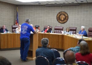 Joseph Standifer, at podium, addresses Groves City Council about the city’s rules on recreational vehicles during a council meeting on Monday in Groves. Mary Meaux/The News 