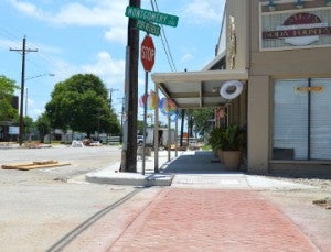 A view of a newly installed crosswalk in the 1200 block of Montgomery Street in Port Neches. A major project is underway to install red brick crosswalks, replace sidewalks, add decorative planters and lighting along Port Neches Avenue. Mary Meaux/The News