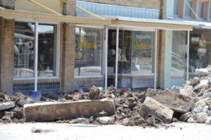 The sidewalk in front of The Yellow Rose Antiques is torn up and will soon be replaced. Businesses remain open during the construction phase. Mary Meaux/The News