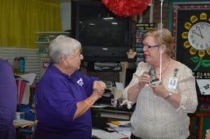 Port Neches-Groves Education Foundation member Clara Graham, left, presents Cindy Downs, second grade teacher at Van Buren Elementary School, with a grant to purchase B-Calm Units for her class on Wednesday. Mary Meaux/The News
