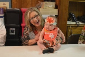 Charmain Taylor holds her granddaughter and future dance student, Dezi Howard, during an event announcing Debbie’s Dance Etc. as the small business of the year in Groves. Mary Meaux/The News