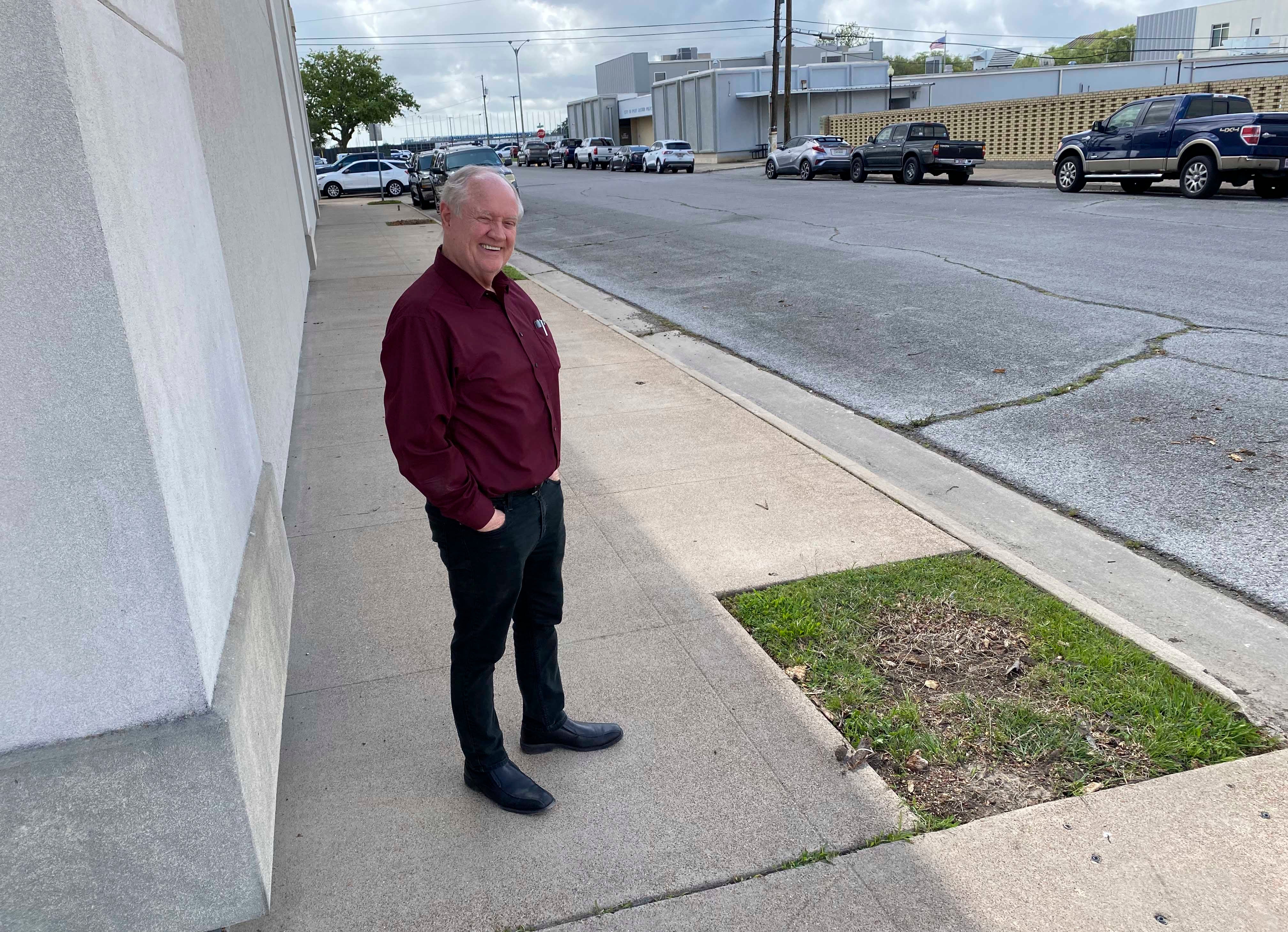 Museum of the Gulf Coast Director Tom Neal stands where dead trees have been removed and new crepe myrtles will be planted next week. (Monique Batson/The News)