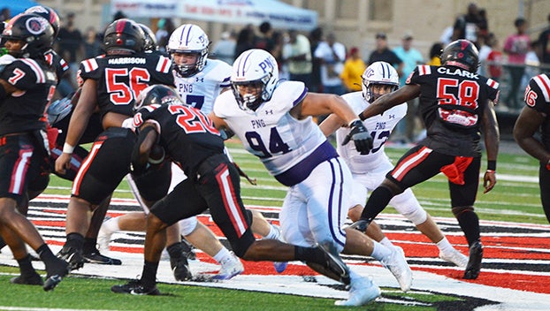 Port Neches-Groves defensive lineman Jonathan Hernandez causing